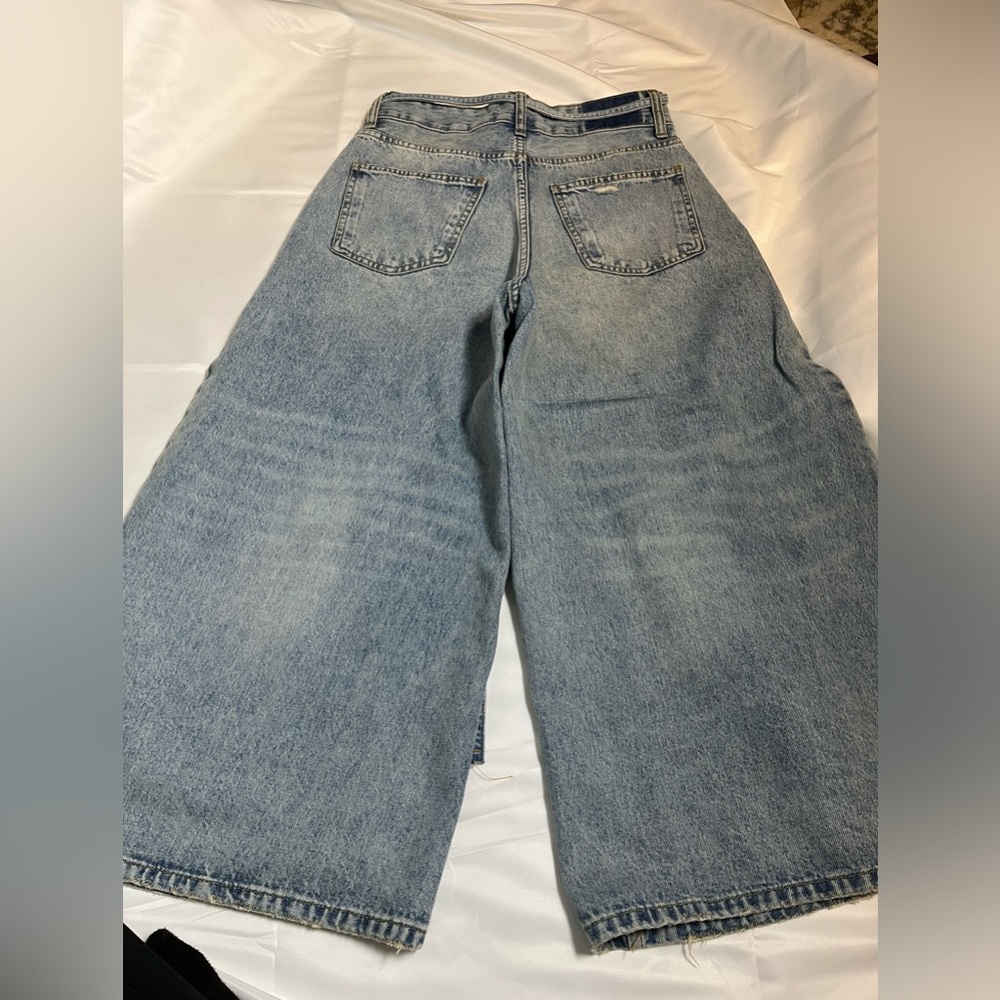 Slightly distressed jeans, worn once . Mint condition